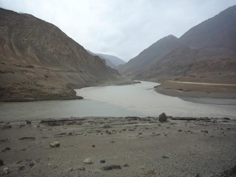 The Indus (darker and slower moving on the left) meets the Zanskar.